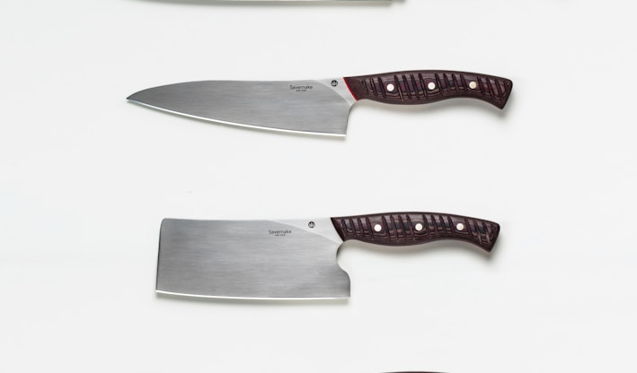 red and silver kitchen knife