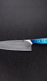 red handled knife on black surface